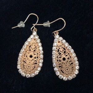 Gold and diamond tear drop earrings.